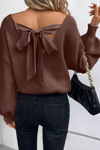 Chic v neck sweater with knot back enhances style.