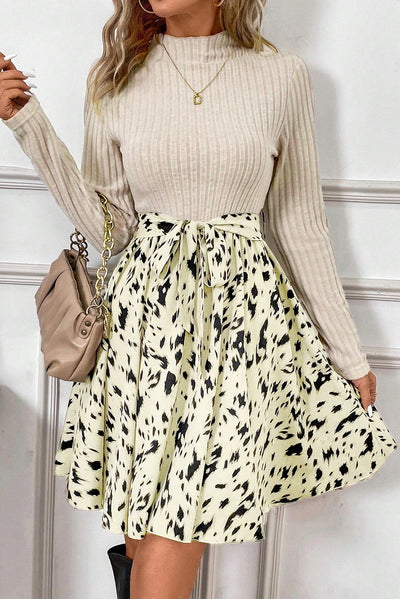 Stay chic and warm in belted sweater mini dress.