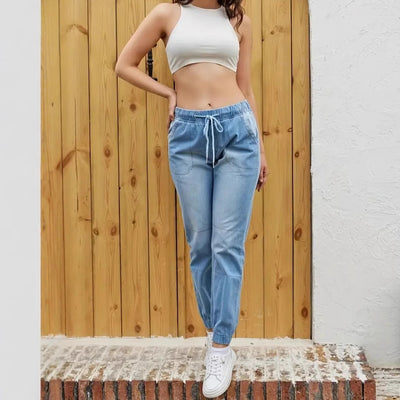 Elastic waistband jeans provide comfort fit for everyday wear.